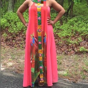 long dress with Ankara designs incorporated into it . Fits up to size 14 US